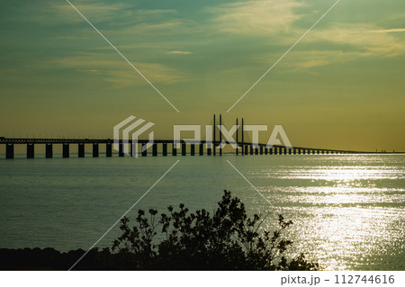 Oresund Bridge on sunset, between Sweden and Denmark, Malmo 112744616