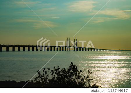 Oresund Bridge on sunset, between Sweden and Denmark, Malmo Oresund Bridge on sunset, between Sweden and Denmark, Malmo 112744617