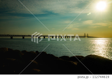 Oresund Bridge on sunset, between Sweden and Denmark, Malmo Oresund Bridge on sunset, between Sweden and Denmark, Malmo 112744619