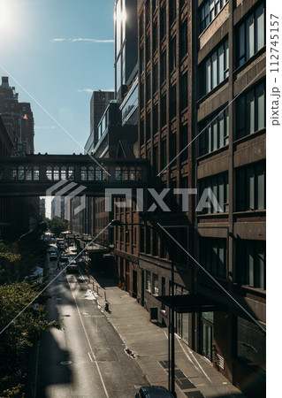 Shadows and Light Play on New York Street Lined with Buildings Shadows and Light Play on New York Street Lined with Buildings 112745157