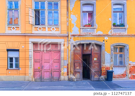 Colorful facade of an old historical residential building in the Hungarian city of Sopron 112747137