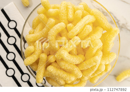 Corn sticks in bowl on table still life. Top view 112747892