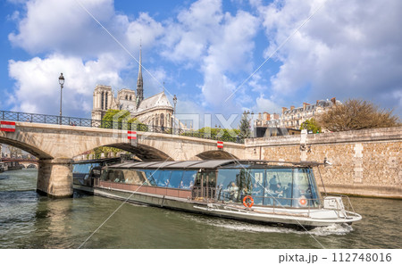 Paris, Notre Dame cathedral with boat on Seine in France 112748016