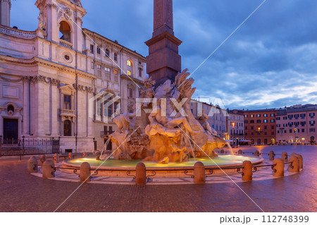 The famous fountains with tritons in Piazza Navona in Rome at dawn. The famous fountains with tritons in Piazza Navona in Rome at dawn. 112748399