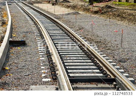 Laying new tram rails on new concrete sleepers with pads that reduces vibration and noise emission 112748533