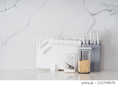 Kitchen utensils on white table Kitchen utensils on white table 112749679