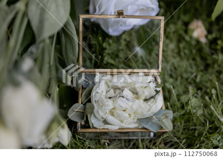 wedding gold rings on a ceremony table wedding gold rings on a ceremony table 112750068