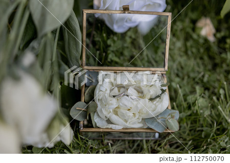 wedding gold rings on a ceremony table wedding gold rings on a ceremony table 112750070