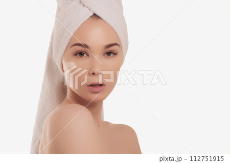 Calm serene young woman in spa bathrobe and towel 112751915