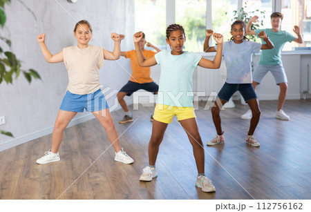Active preteen children practicing Hip-hop dance in training hall 112756162