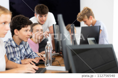 Boy student learning to work on computer in classroom 112756540