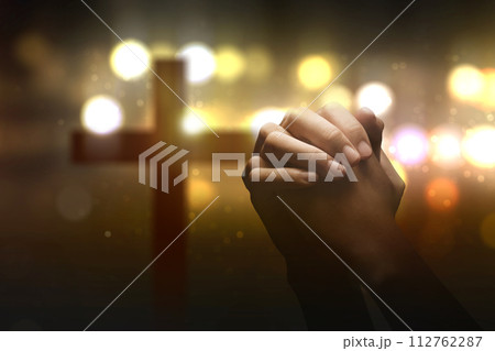 Christian man praying with raised hands Christian man praying with raised hands 112762287