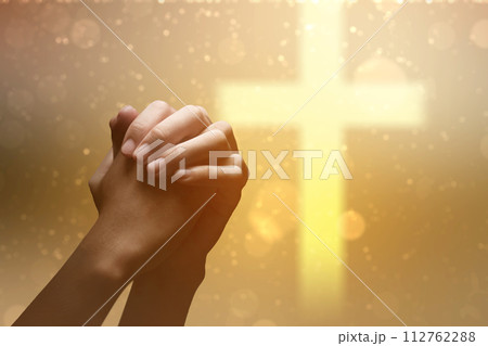 Christian man praying with raised hands 112762288