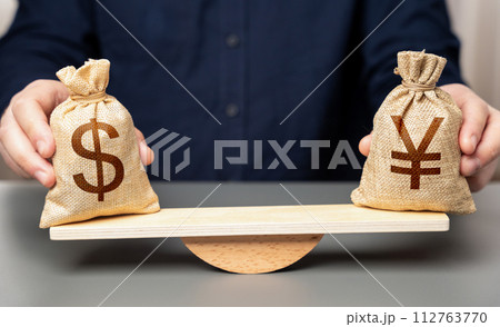 Exchange rate between dollar and japanese yen. Interest rates, inflation. GDP total economic output. Comparison of two economies. 112763770