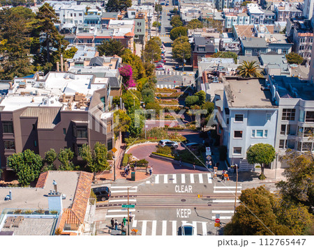 Panoramic view of aerial Lombard Street, an east west street in San Francisco, California. Famous for steep, one block section with eight hairpin turns. Crookedest, steep hills, sharp curves 112765447