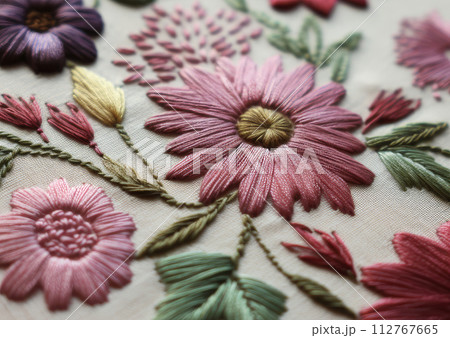 AI-generated content. Close-up of a colorful embroidered flower with detailed stitches on fabric 112767665