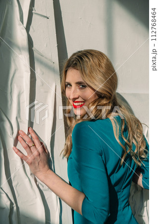 portrait of beautiful woman in dress 112768464