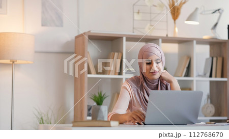 Video conference virtual coach woman laptop home 112768670