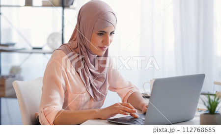 Distance work freelancer woman laptop home office Distance work freelancer woman laptop home office 112768685