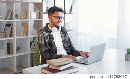 Online coach video meeting man laptop call home Online coach video meeting man laptop call home 112768687