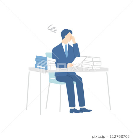 書類の山に頭を抱えるビジネスマン 112768703
