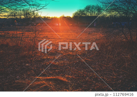 Sunset over the village in early spring Sunset over the village in early spring 112769416