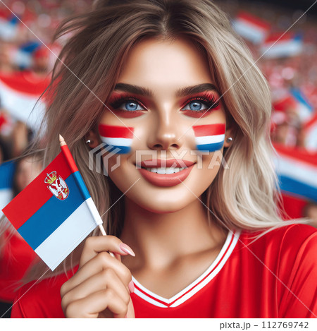 Serbian Young Female Soccer Fan with Painted National Flag Cheeks at European Football, Soccer Championship Serbian Young Female Soccer Fan with Painted National Flag Cheeks at European Football, Soccer Championship 112769742