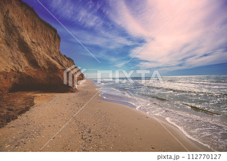 Seascape with a steep clay shore Seascape with a steep clay shore 112770127
