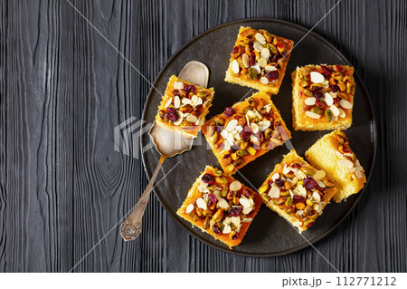 slices of yogurt cake with nuts and dried berries slices of yogurt cake with nuts and dried berries 112771212