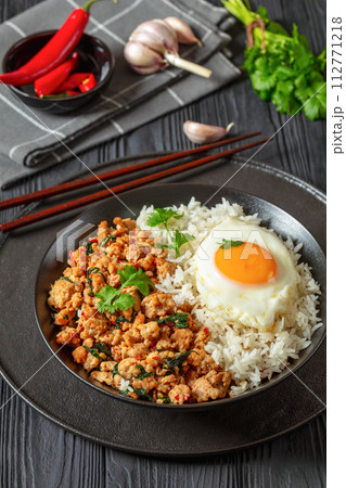 basil chicken stir fry with rice and fried egg basil chicken stir fry with rice and fried egg 112771218
