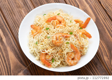 Instant noodle with shrimps and onion Instant noodle with shrimps and onion 112772892