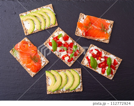 Protein toast ceispbread with delicious toppings top view Protein toast ceispbread with delicious toppings top view 112772924