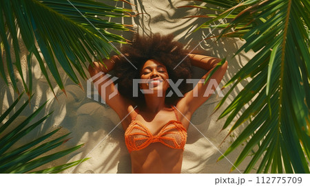 AI-generated content. A Woman Is Laying On Her Back Under A Palm Tree And Smiling 112775709