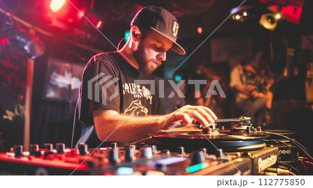 AI-generated content. A DJ wearing headphones is seen in action, mixing music on the turntables at a lively party or club event 112775850