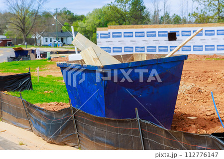 Metal container dumpster for storing construction junk recycle waste at construction site Metal container dumpster for storing construction junk recycle waste at construction site 112776147