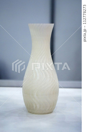 Abstract art object printed on 3D printer. White creative model printed on 3D printer from molten ABS, PLA plastic filament. Object printed on FDM printer. Additive progressive new modern technology 112778273