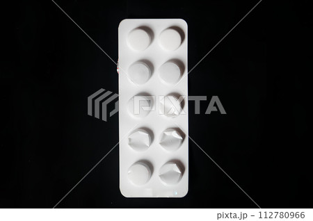 A white pill bottle with a black background A white pill bottle with a black background 112780966