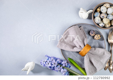 Stylish Easter table serving for cafes and restaurants in gray Top view Horizontal format Copy space 112780992
