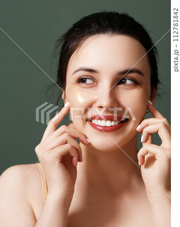 A young beautiful smiling woman with cosmetic 112781842