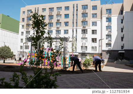 Residential buildings with a playground in the courtyard Residential buildings with a playground in the courtyard 112781934