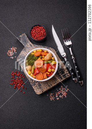 Delicious healthy vegetables steamed carrots, broccoli, asparagus beans and peppers Delicious healthy vegetables steamed carrots, broccoli, asparagus beans and peppers 112782166