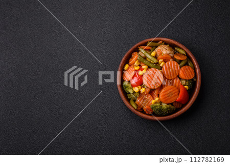 Delicious healthy vegetables steamed carrots, broccoli, asparagus beans and peppers Delicious healthy vegetables steamed carrots, broccoli, asparagus beans and peppers 112782169
