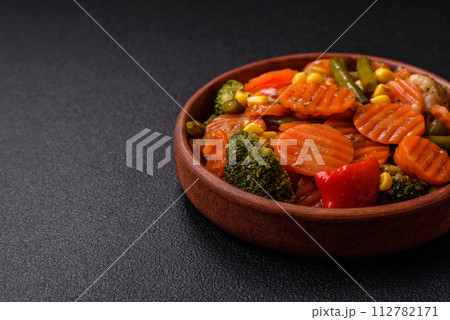 Delicious healthy vegetables steamed carrots, broccoli, asparagus beans and peppers Delicious healthy vegetables steamed carrots, broccoli, asparagus beans and peppers 112782171
