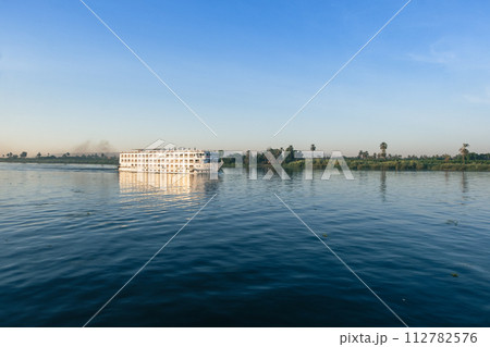 Nile River Encounter: Contrasting Cruise Ships Egypt Summer Travel 112782576