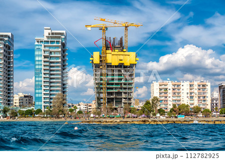 Crane and construction site along Limassol seafront. Cyprus Crane and construction site along Limassol seafront. Cyprus 112782925