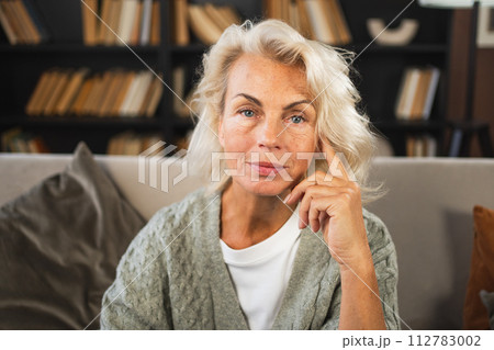 Portrait of confident stylish European middle aged senior woman. Older mature 60s lady smiling at home. Happy attractive senior female looking camera close up face headshot portrait. Happy people Portrait of confident stylish European middle aged senior woman. Older mature 60s lady smiling at home. Happy attractive senior female looking camera close up face headshot portrait. Happy people 112783002