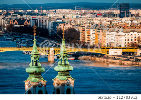 Margaret bridge and St. Anna Church at Danube embankment. Budapest, Hungary 112783912