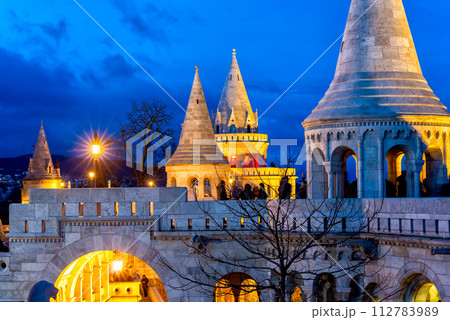 Night view of Fisherman's Bastion on Buda bank of the Danube river. Castle hill, Budapest, Hungary Night view of Fisherman's Bastion on Buda bank of the Danube river. Castle hill, Budapest, Hungary 112783989