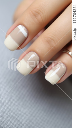 Calm beauty delicate nail design for a girl, beautiful female hands with a well-groomed neutral manicure 112784284