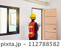 Men home Inspector surveyor wearing vests and hard hat at new property 112788582